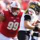 Illustration for article titled Wisconsins Nose Tackle Is Doing Backflips In The Sand Like Its Nothing